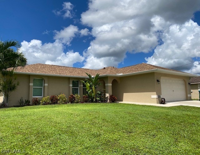 ranch-style house featuring a garage and a front lawn