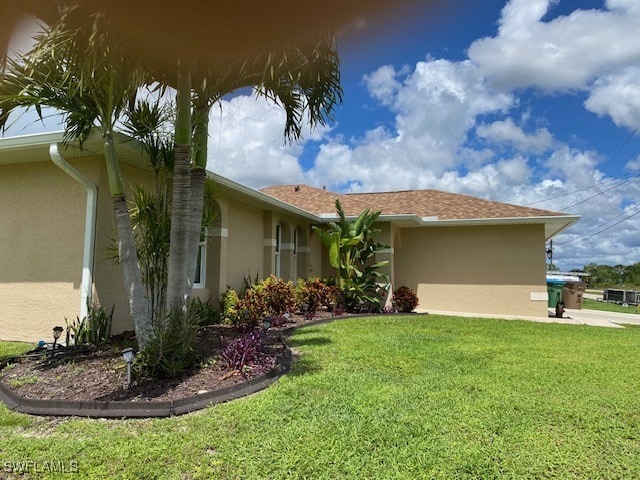 view of property exterior featuring a lawn