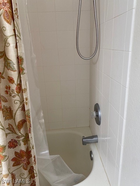 bathroom with shower / bath combination with curtain