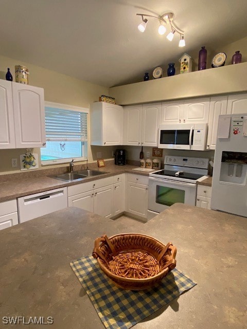 kitchen with white cabinets, white appliances, and sink