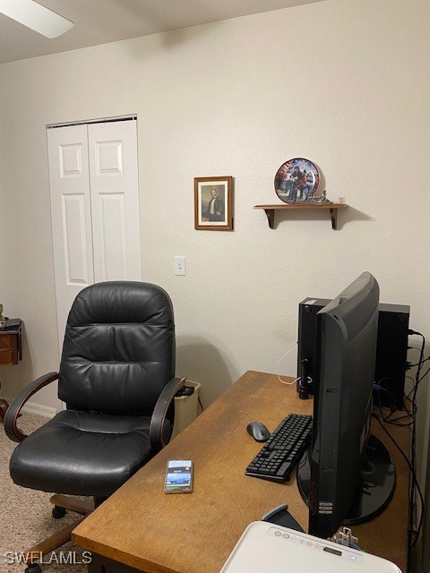 office with ceiling fan and carpet flooring