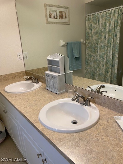 bathroom with vanity and tile patterned flooring