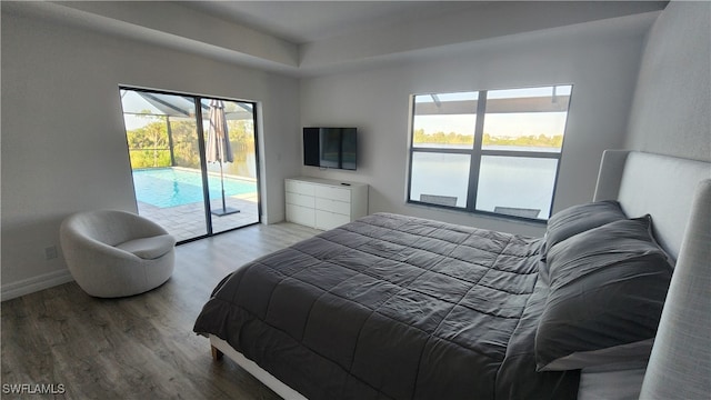 bedroom featuring access to outside and hardwood / wood-style floors