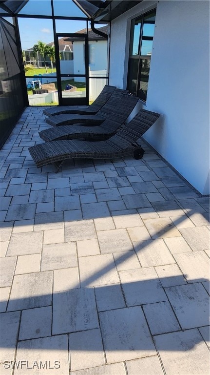 view of patio with a lanai