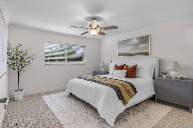 carpeted bedroom with ceiling fan and ornamental molding