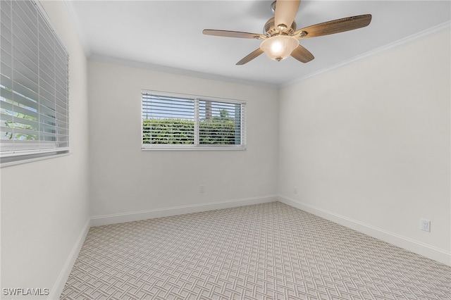 unfurnished room with ceiling fan, light colored carpet, and crown molding