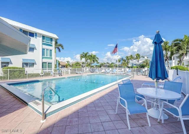 view of swimming pool featuring a patio