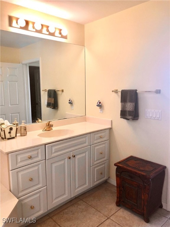 bathroom with tile patterned flooring and vanity