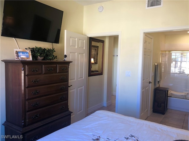 bedroom with light tile patterned floors