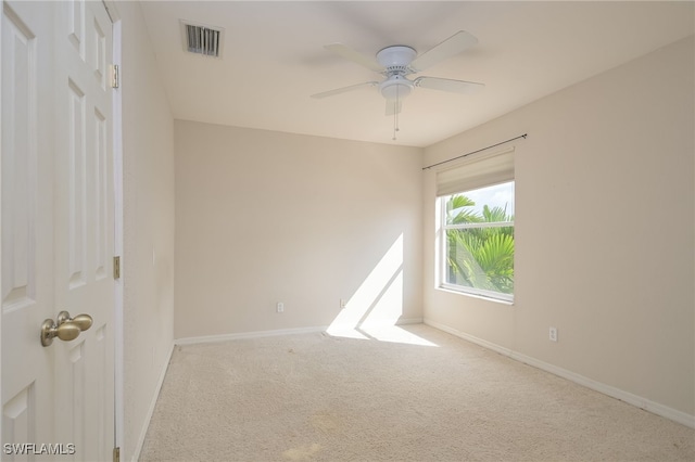 unfurnished room with carpet and ceiling fan