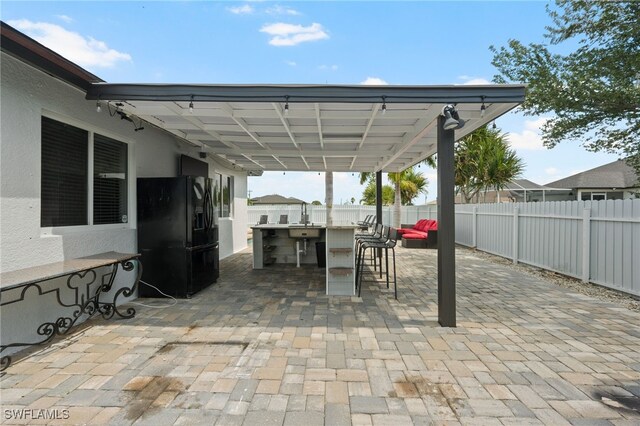 view of patio featuring exterior bar