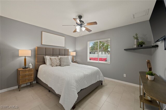 tiled bedroom with ceiling fan