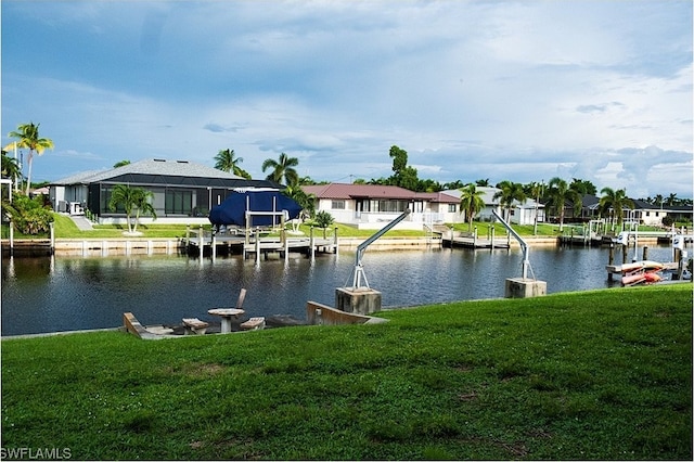 view of dock featuring a yard, a water view, and a lanai