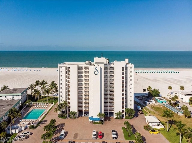 bird's eye view featuring a beach view and a water view