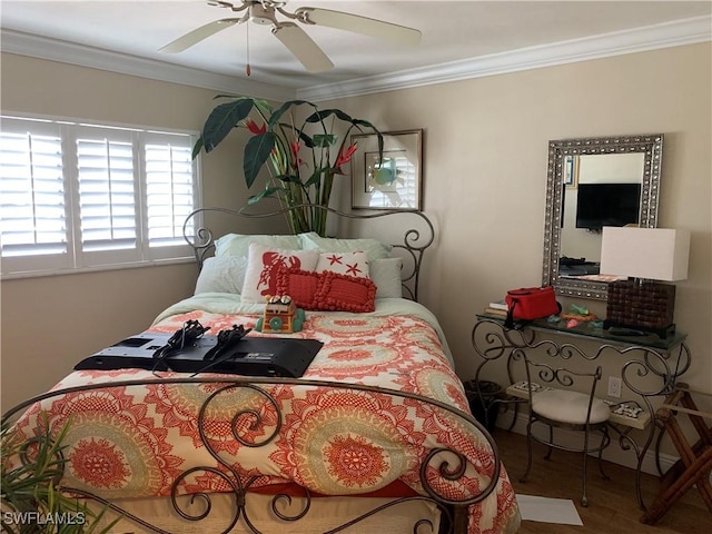 bedroom featuring ceiling fan and crown molding