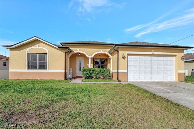 view of front of property featuring a front yard and a garage