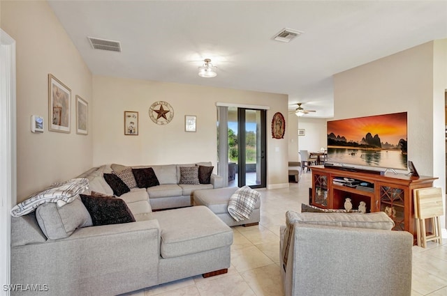 tiled living room featuring ceiling fan