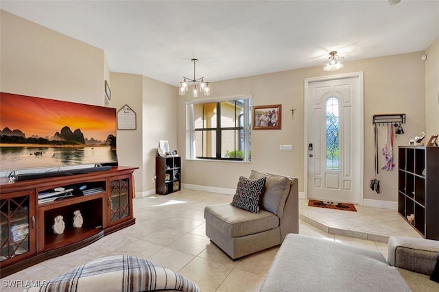 living room with a notable chandelier, plenty of natural light, and light tile patterned floors