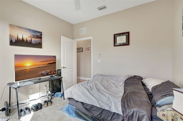 bedroom featuring light tile patterned flooring and ceiling fan