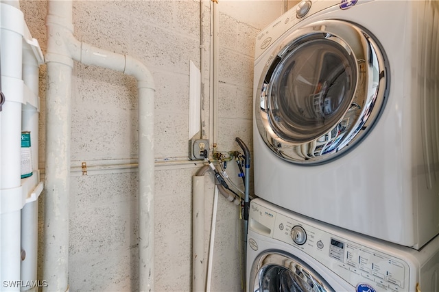 washroom with stacked washer / drying machine