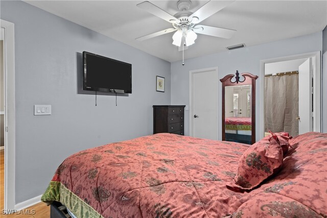 bedroom with wood-type flooring and ceiling fan