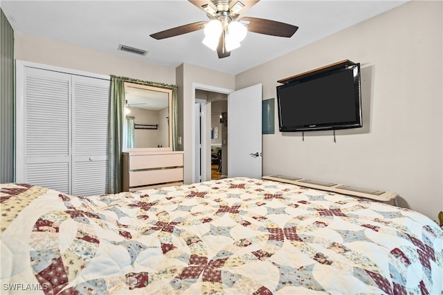 bedroom with ceiling fan and a closet