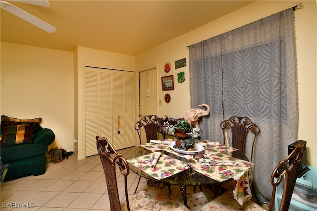 dining area featuring light tile patterned floors and ceiling fan