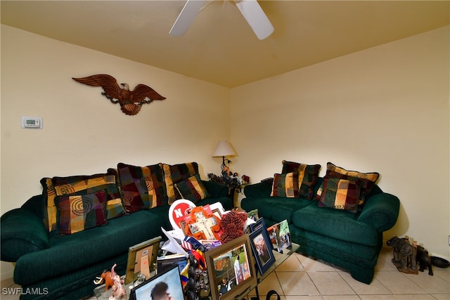 living room with ceiling fan and light tile patterned flooring