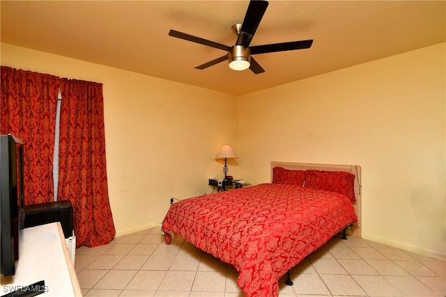 tiled bedroom with ceiling fan