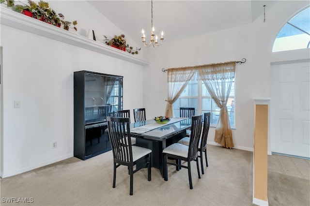 dining space with a wealth of natural light, light carpet, high vaulted ceiling, and a notable chandelier