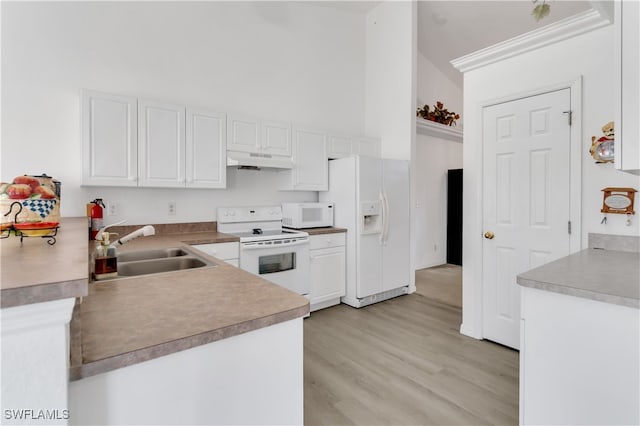 kitchen featuring white cabinets, light wood-type flooring, sink, and white appliances