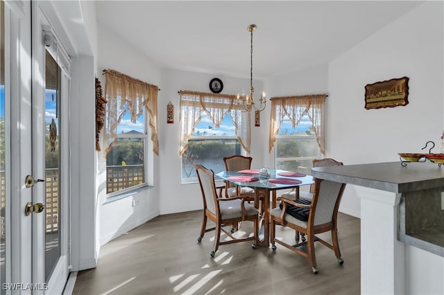 dining area featuring a notable chandelier