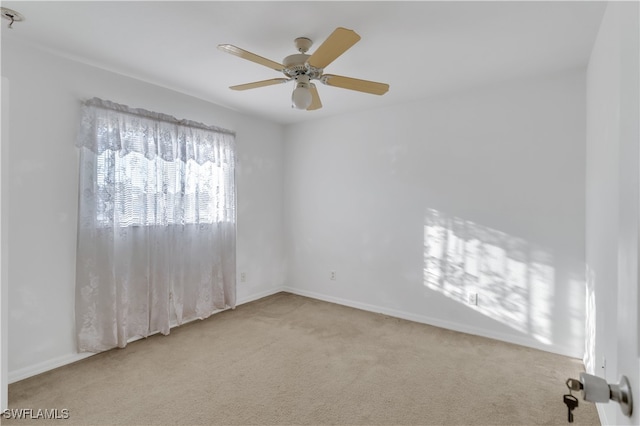 carpeted empty room with ceiling fan