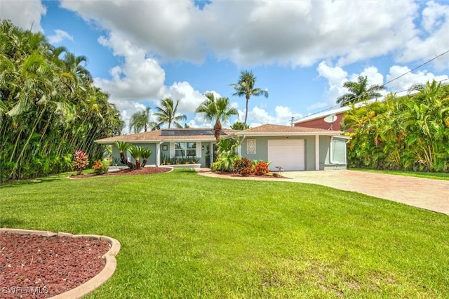 ranch-style house with a front yard and a garage