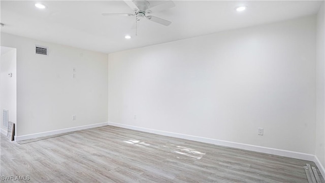 spare room with ceiling fan, recessed lighting, visible vents, baseboards, and light wood-style floors