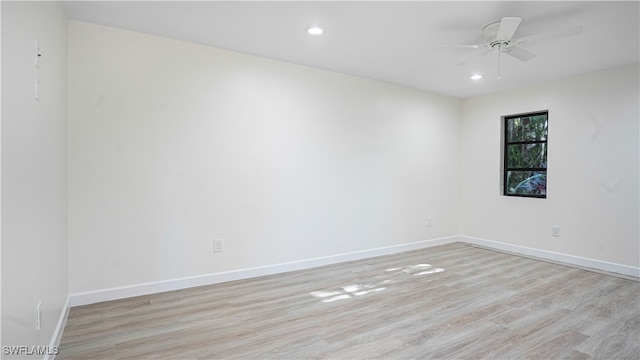 unfurnished room with ceiling fan and light hardwood / wood-style floors