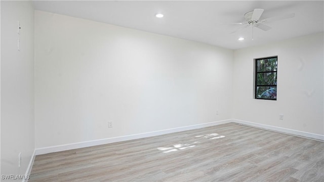 empty room featuring ceiling fan, recessed lighting, light wood-style flooring, and baseboards