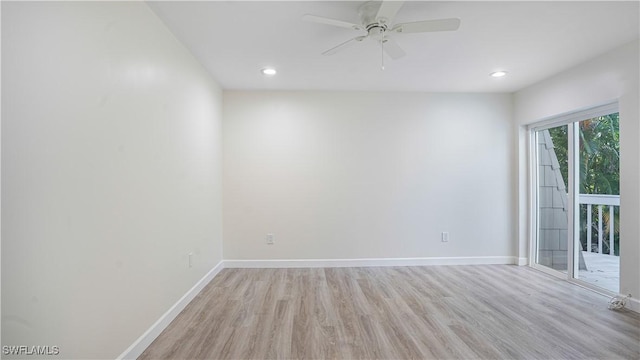 spare room featuring a ceiling fan, recessed lighting, light wood-style flooring, and baseboards