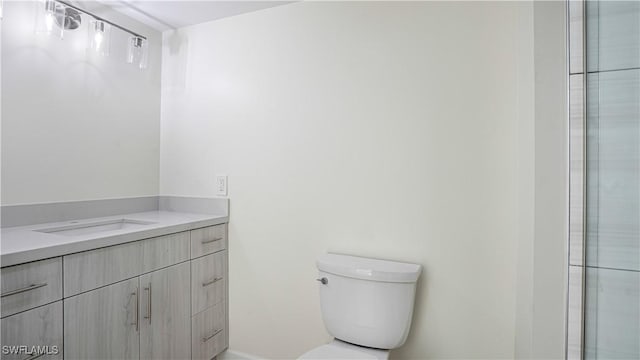 bathroom with toilet and vanity