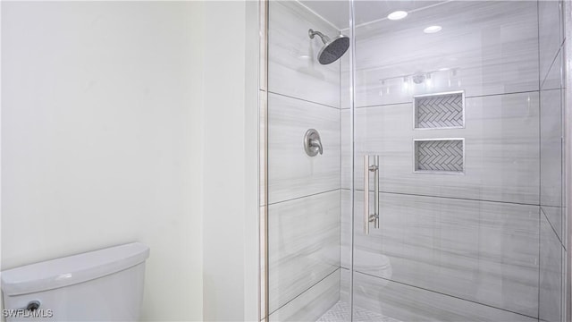 full bath with a shower stall and toilet