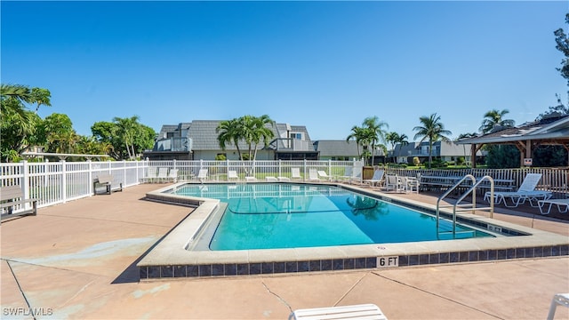 view of swimming pool with a patio area