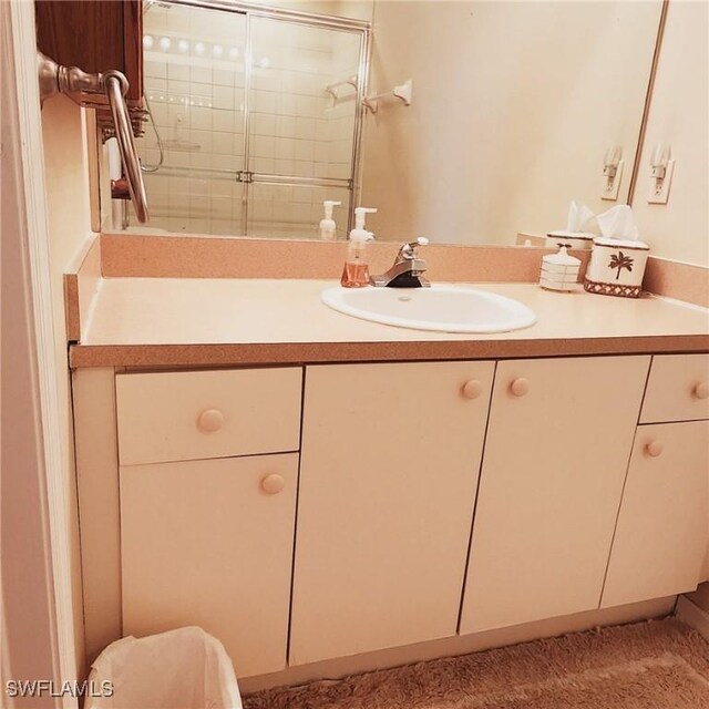 bathroom featuring vanity and walk in shower