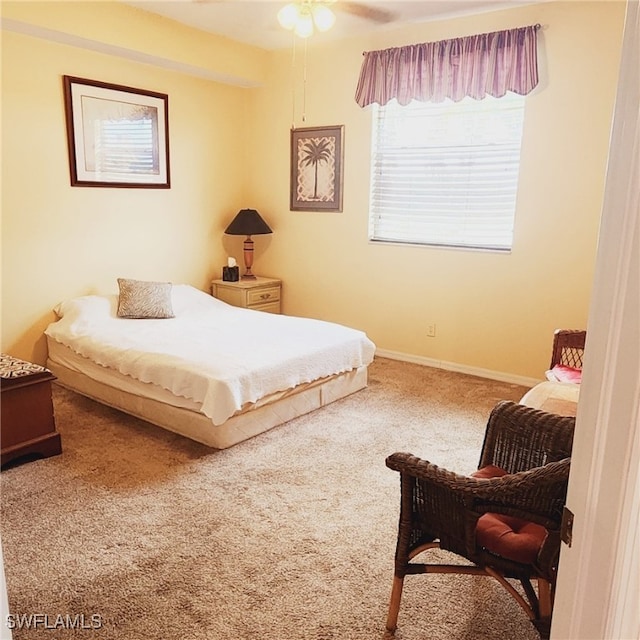 bedroom with ceiling fan and carpet