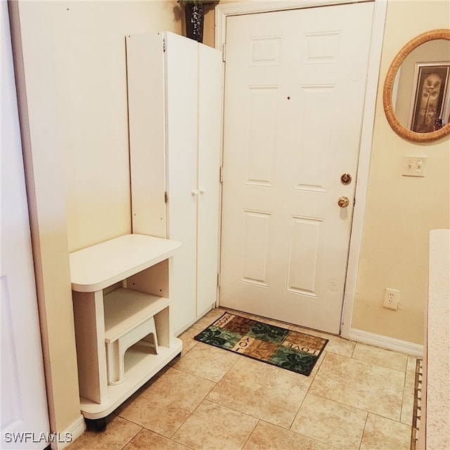 mudroom featuring light tile patterned flooring