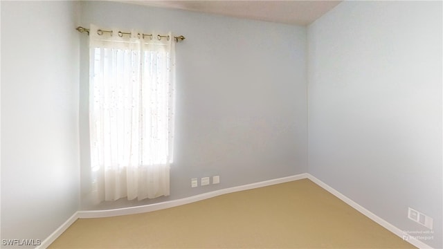 empty room featuring carpet flooring