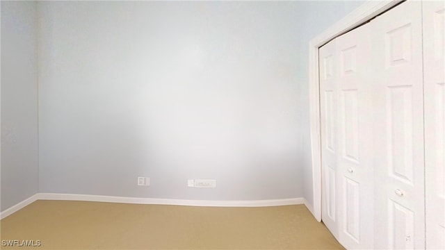 unfurnished bedroom featuring a closet