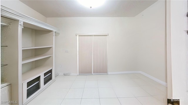 spacious closet featuring light tile patterned flooring