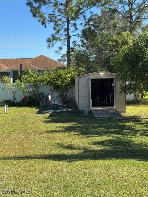 view of yard with a storage unit