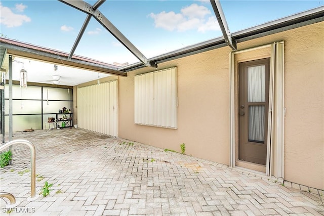 view of patio with a lanai