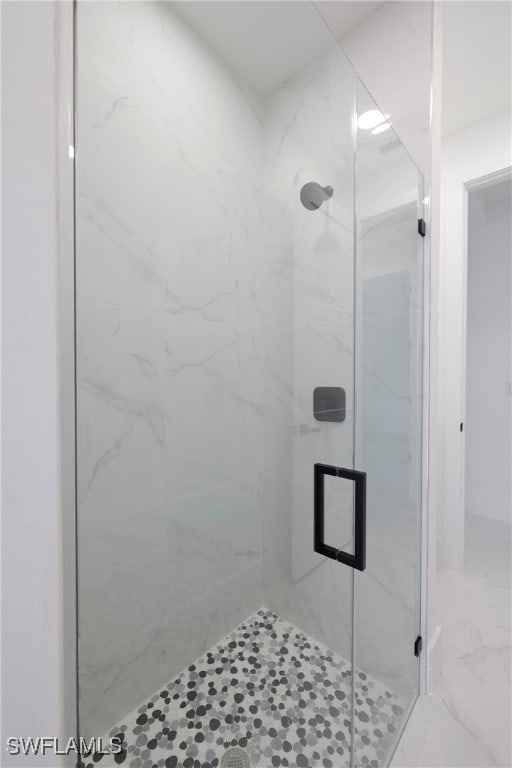 bathroom with an enclosed shower